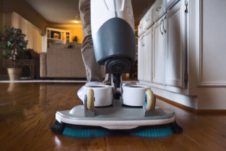 Wood floor cleaning machine being used on hardwood